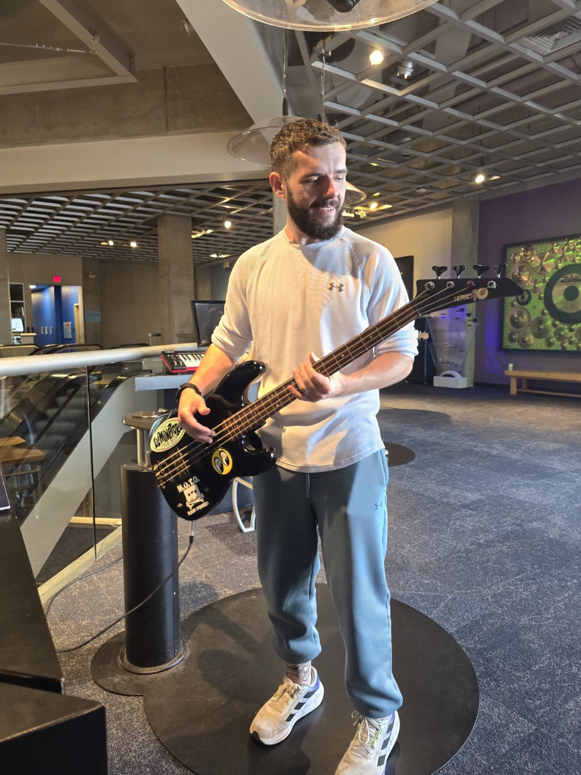 Me holding a black electric guitar