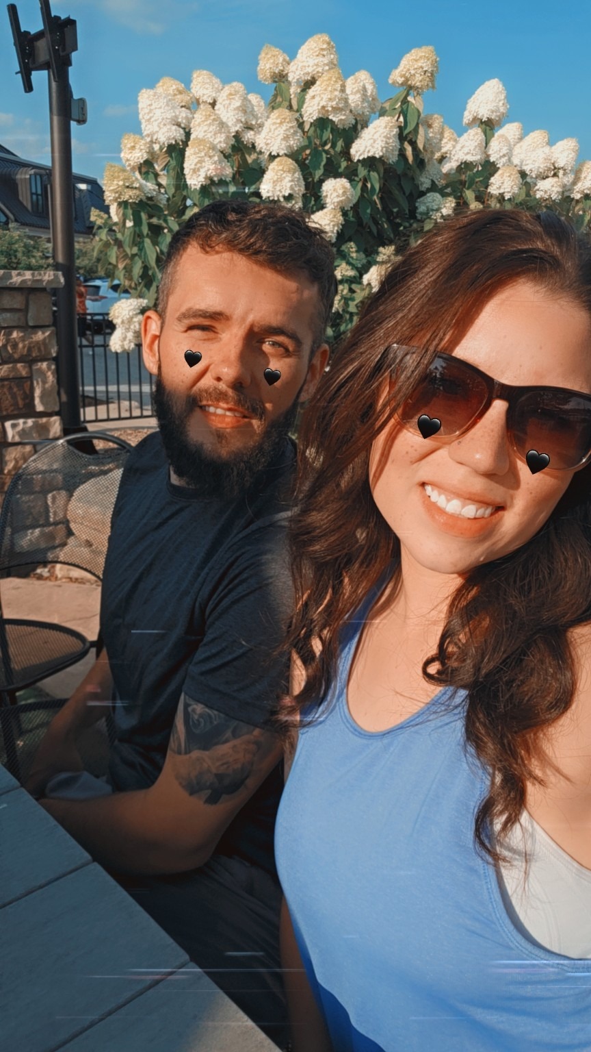 You and me seated outdoors in the sunshine